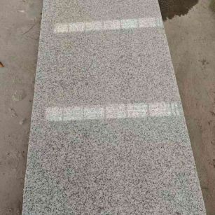 保山芝麻白光面毛板